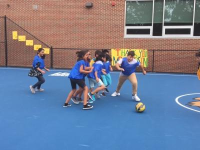 photo of students playing soccer